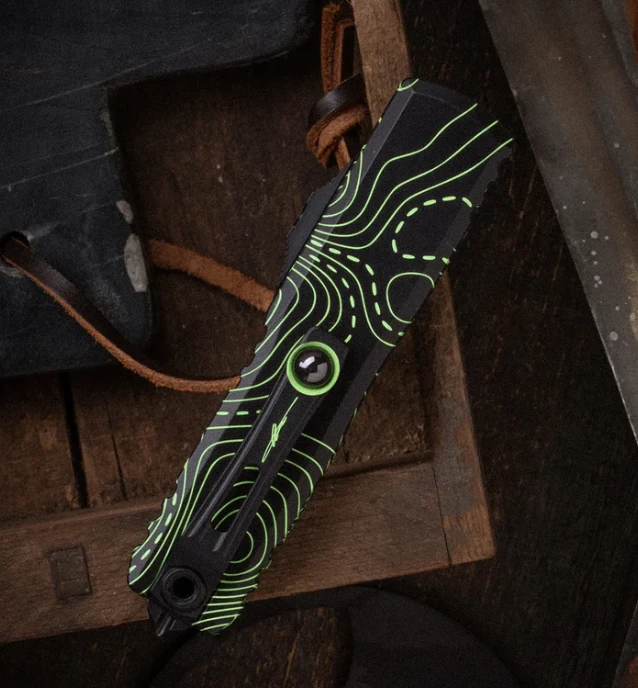Microtech UTX-85 Gen IV Signature Series OTF Automatic Partially Serrated Topographic Black and Parakeet Green Camo T/E AUMT123342TPBKPGCS View 2