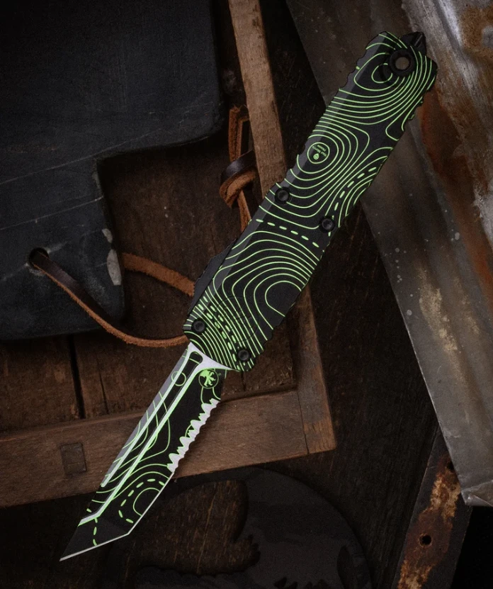 Microtech UTX-85 Gen IV Signature Series OTF Automatic Partially Serrated Topographic Black and Parakeet Green Camo T/E AUMT123342TPBKPGCS View 1