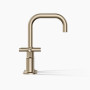 Kohler Purist®Widespread bathroom sink faucet with low cross handles and low gooseneck spout in Vibrant Brushed Bronze