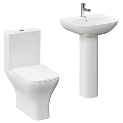 A modern white close coupled toilet and basin set