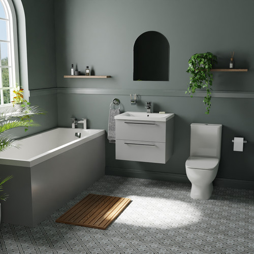 A modern bathroom suite including straight single ended bath, vanity unit and close coupled toilet