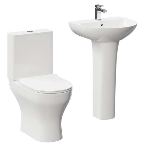A modern white close coupled toilet and basin set