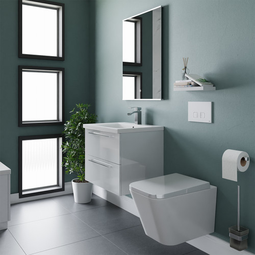 A modern vanity and toilet suite including concealed cistern and flushplate