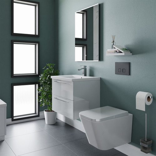 A modern vanity and toilet suite including concealed cistern and flushplate