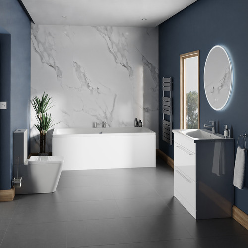 A modern bathroom suite including straight double ended bath, vanity unit and close coupled toilet