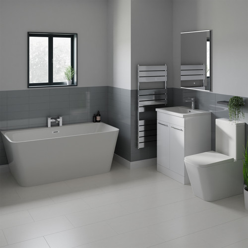 A modern bathroom suite including double ended back to wall freestanding bath, vanity unit and close coupled toilet