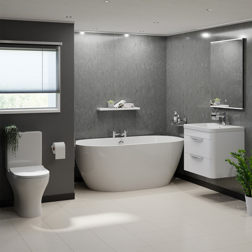 A modern bathroom suite including double ended freestanding bath, vanity unit and close coupled toilet