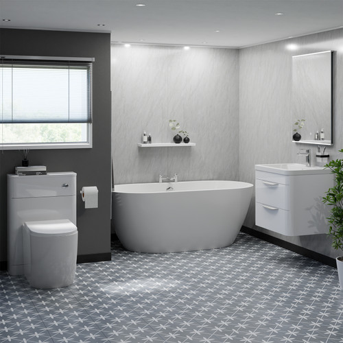 A modern bathroom suite including double ended freestanding bath, vanity unit and back to wall toilet