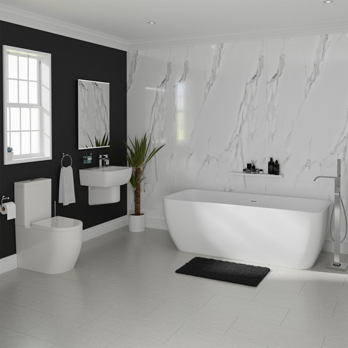 A modern bathroom suite including double ended freestanding bath, basin, pedestal and close coupled toilet