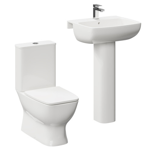 A modern white close coupled toilet and basin set