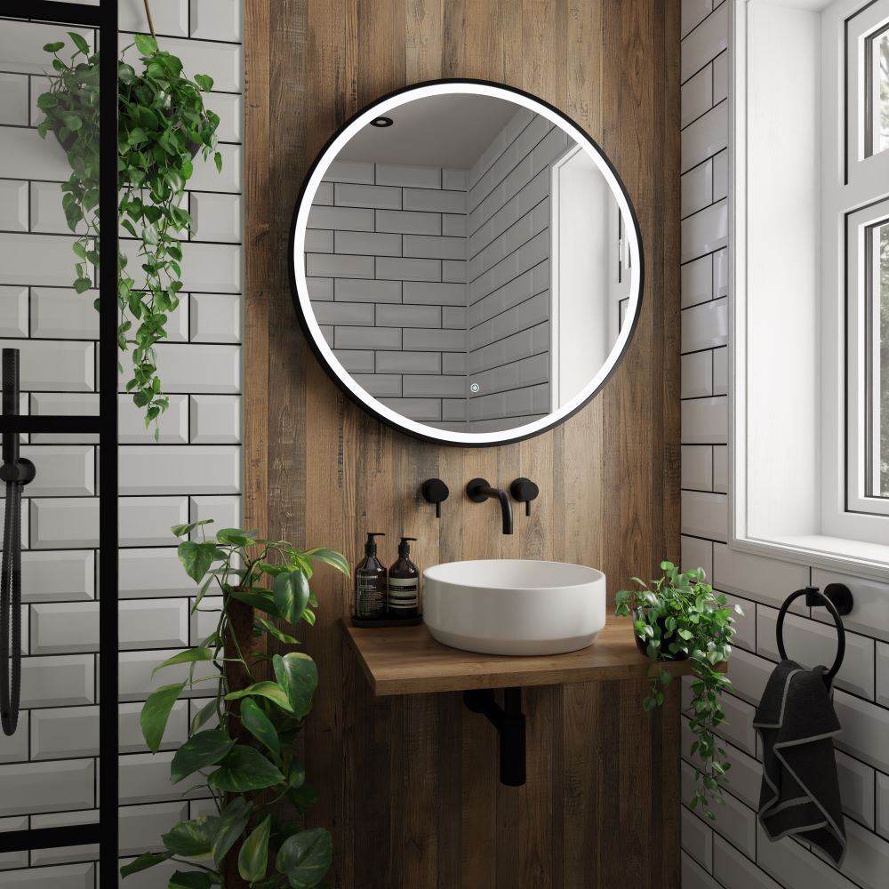 Wood effect wall panel behind a basin with white metro tiles either side