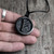 Shungite rune pendant with adjustable waxed cord 2mm, length 25–65 cm, pendant size 36mm. Natural Karelian shungite stone, over 2 billion years old, electrically conductive, contains fullerenes. Protects against EMF, purifies energy, ideal for daily wear and spiritual practices.