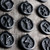 Close‑up of a single Elder Futhark rune carved deeply into natural black shungite stone. Visible texture of the hand‑engraved symbol, waxed cord attached through the hole. Perfect for daily wear as a protective amulet.