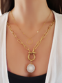Woman Wearing A Gold Cable Lock Necklace With Crystal Slice Pendant