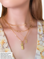 Woman Wearing A Gold Choker Chain, A Gold Paperclip Chain and Two Gold Filled Necklaces Layered with A Body Charm And A Bitch Pendant | Mojo Supply Co