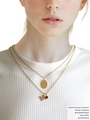 Woman Wearing Dainty Gold Necklaces With Birth Flower Pendant