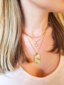 Woman Wearing Star and Rising Sun Tarot Card Necklaces