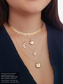 Woman Wearing A Gold Filled Arrow Choker Chain And Three Gold Filled Necklaces Layered with An Opal Star Charm, Two Openable Gold Round Pendants And A CZ Studded Crescent Moon Charm | Mojo Supply Co