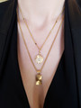 Woman Wearing Thin Emily Gold Chain Necklace Paired With Cali WhiteHowlite Gold Filled Pendant And Thick Gold Chain Necklace Accentuated With FabaGold Filled Medallion Charm