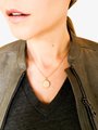 Woman In Gray Leather Jacket Wearing Dainty Solid Gold Curb Necklace And Celestial Opal Pendant