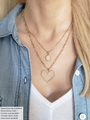 Layered gold necklaces with a Heart Lined with White Beads and Pink Oval Stone