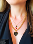 Kimmie cherries styled with other pendants and necklaces