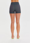 THE UPSIDE women's check Aliki 3inch Spin Short features a mid-rise fit, elastic drawcord in a textured green gingham fabric. Made for Pilates and yoga.