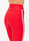 THE UPSIDE women's red eco tech Oxford 25-inch Legging is supportive and comfortable with cream side stripes and an elastic waist drawcord. Made for high impact.