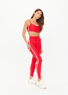 THE UPSIDE women's red eco tech Oxford 25-inch Legging is supportive and comfortable with cream side stripes and an elastic waist drawcord. Made for high impact.