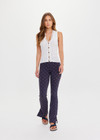 THE UPSIDE women's creme Rosella V Neck Vest has a slim fit with tortoiseshell button closure and beige striped ribbing along the neckline and front. Made for lifestyle.
