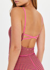 THE UPSIDE women's pink check Aliki Kiva Bodysuit features elastic straps, low cross back, and inner shelf bra with removable cups. Made for yoga and pilates.