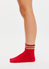 THE UPSIDE women’s red Curio Crew Sock with jacquard stripes in gold metallic yarn.