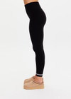 THE UPSIDE women’s black merino Wool Seamless 25inch Legging offers a soft & comfortable fit and features white striped ribbing on cuffs. Designed for Après-ski and winter wear.