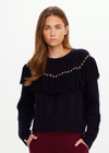 THE UPSIDE women’s navy Clara Tassle Knit Sweater is a relaxed, cable knit design featuring knotted tassels on front and back. Designed for Après-ski and winter wear.