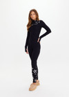 THE UPSIDE women’s black Superstar Nova Jumpsuit offers a firm & supportive fit in our jacquard stretch fabrication and features a mock neck zip through and thumb holes. Designed for Après-ski and winter wear.