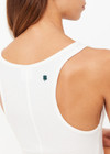 THE UPSIDE women’s white Alyssa Racerback Tank Top features rib fabric, a scoop neck, and embroidered 4-leaf clover at the back. Made for everyday leisure.