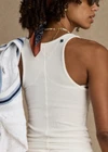 THE UPSIDE women’s white Alyssa Racerback Tank Top features rib fabric, a scoop neck, and embroidered 4-leaf clover at the back. Made for everyday leisure.
