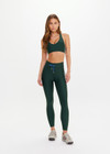 THE UPSIDE women’s green Maneki Jetta Racerback Bra features a V-neck in recycled fabric, removable cups, and elastic underbust support. Made for yoga and pilates.