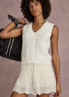 THE UPSIDE women’s cream organic cotton Espada Hermina V Neck Vest is designed for a regular fit and features a chunky cable knit texture. The perfect lifestyle piece.