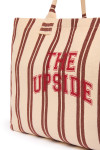 THE UPSIDE women's stripe organic cotton Baja Rhodes Tote Bag features tubular straps and a yarn-dyed cream and burnt red stripe design.