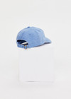 THE UPSIDE women's blue cotton Washed Denim Soft Cap offers a soft, retro fit with an embroidered cream horseshoe logo and an adjustable back strap. Made for everyday wear.