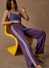 THE UPSIDE women's purple Roma Pant is high-waisted with a drawcord, coated metal aglets, and side seam pockets. Perfect for travel or lifestyle.