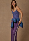 THE UPSIDE women's purple Roma Pant is high-waisted with a drawcord, coated metal aglets, and side seam pockets. Perfect for travel or lifestyle.