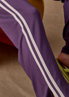 THE UPSIDE women's purple Roma Pant is high-waisted with a drawcord, coated metal aglets, and side seam pockets. Perfect for travel or lifestyle.