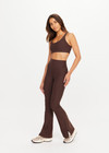 THE UPSIDE women's brown Peached Florence Flare is a high-rise full length flare pant with V waistband and a printed arrow logo on back waistband.
