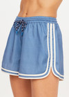 THE UPSIDE women's blue Klio Short is designed for a mid-rise, relaxed fit and features a soft elasticated waistband with drawcord and contrast binds in cream along curved hem. Made for everyday.