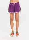 THE UPSIDE women's purple Klio Short is designed for a mid-rise, relaxed fit and features a soft elasticated waistband with drawcord and contrast binds in cream along curved hem. Made for everyday.