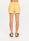 THE UPSIDE women's yellow Klio Short is designed for a mid-rise, relaxed fit and features a soft elasticated waistband with drawcord and contrast binds in cream along curved hem. Made for everyday.