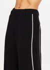 THE UPSIDE women's black Haveli Wide Leg Pant is true to size with a structured waistband, fly zipper, belt loops, and cream embroidered side seams. Made for lifestyle.