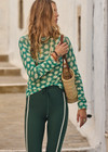 THE UPSIDE women's green Latania Ada Long Sleeve Knit is regular fit with a geometric print and striped knitted rib neckline. Made for lifestyle.